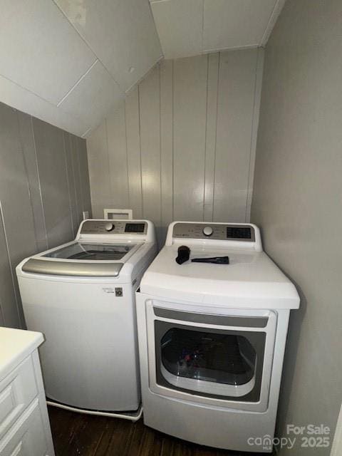 laundry area featuring laundry area, dark wood-style floors, and washer and clothes dryer