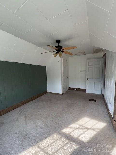bonus room with a ceiling fan, visible vents, carpet, and lofted ceiling