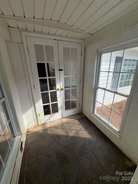 unfurnished sunroom featuring french doors