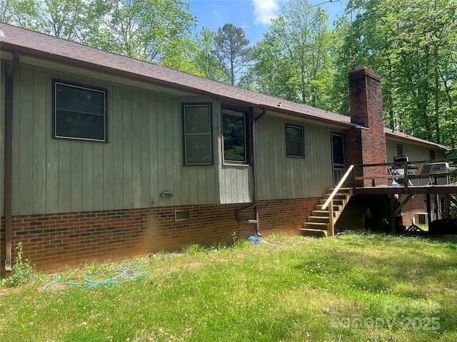 1502 Shelby Hwy, Cherryville, NC 28021 - view of home's exterior featuring stairway, a wooden deck, a chimney, a lawn, and crawl space