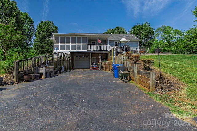 174 Perrin Dr, Mooresville, NC 28117 - view of front of house with driveway, a sunroom, a garage, and a front yard