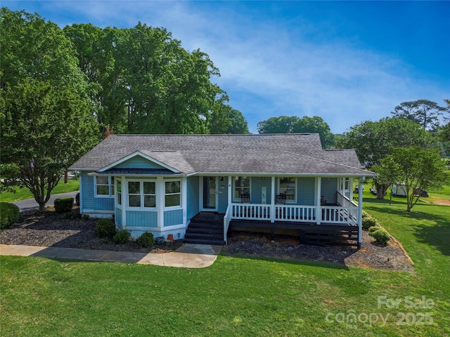 174 Perrin Dr, Mooresville, NC 28117 - view of front of house with a porch, a front yard, and roof with shingles