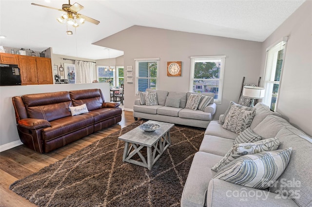 174 Perrin Dr, Mooresville, NC 28117 - living room with wood finished floors, vaulted ceiling, ceiling fan, and baseboards