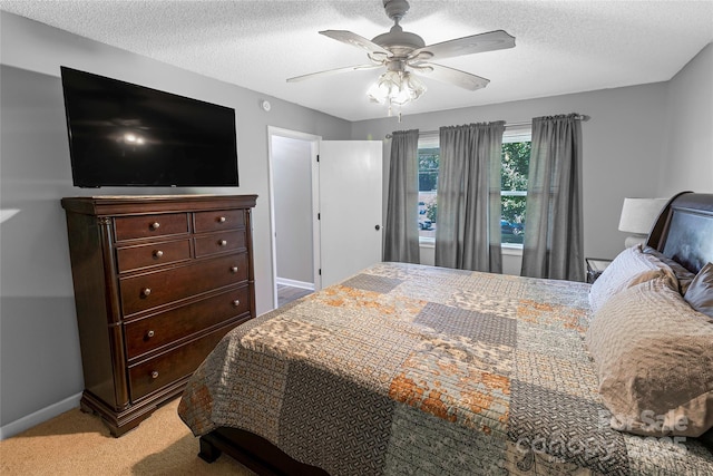 174 Perrin Dr, Mooresville, NC 28117 - bedroom with light colored carpet, a textured ceiling, ceiling fan, and baseboards