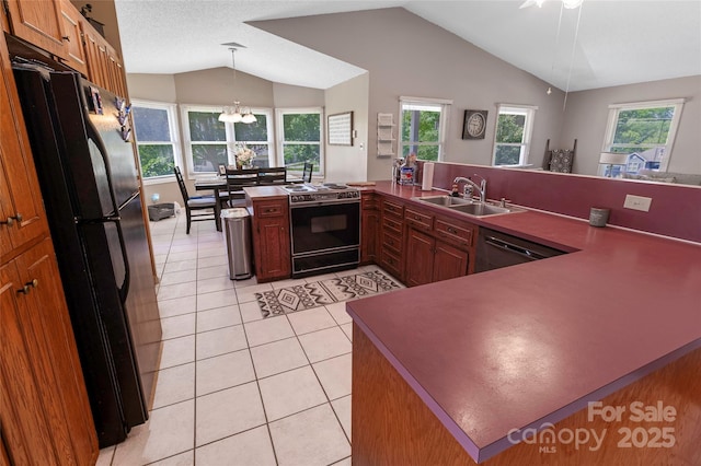 174 Perrin Dr, Mooresville, NC 28117 - kitchen featuring freestanding refrigerator, range with electric cooktop, a sink, lofted ceiling, and dishwashing machine