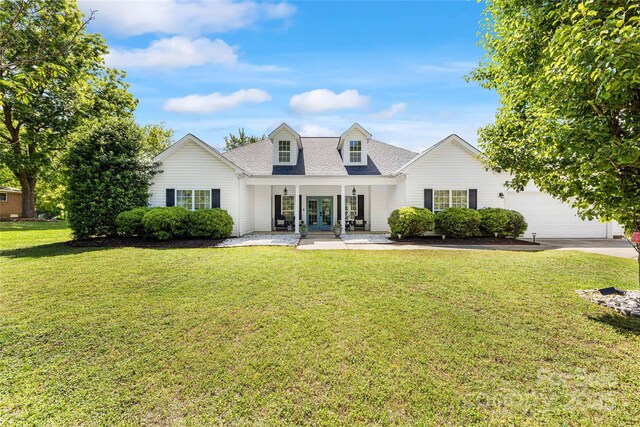 1728 Privette Rd, Matthews, NC 28105 - view of front of property featuring french doors, a shingled roof, a front yard, an attached garage, and driveway