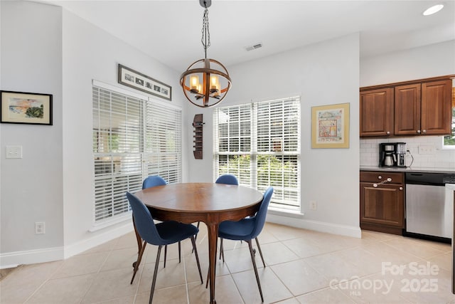 1728 Privette Rd, Matthews, NC 28105 - dining area featuring a chandelier, baseboards, healthy amount of natural light, and light tile patterned floors