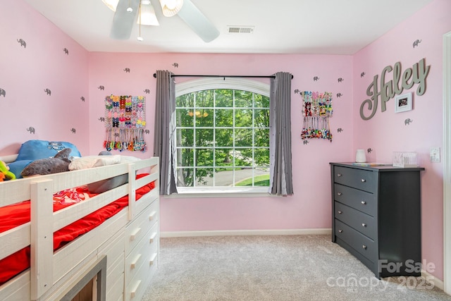 bedroom with visible vents, carpet floors, and multiple windows