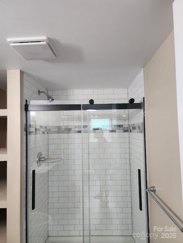 bathroom featuring a shower stall