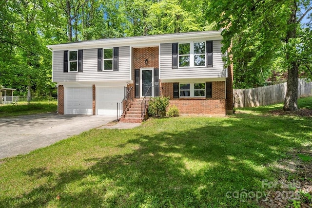 6839 Wagon Oak Rd, Charlotte, NC 28212 - bi-level home with brick siding, driveway, fence, and a garage