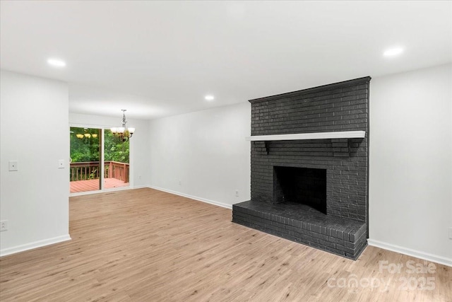 6839 Wagon Oak Rd, Charlotte, NC 28212 - unfurnished living room with recessed lighting, an inviting chandelier, and light wood-type flooring