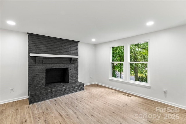 6839 Wagon Oak Rd, Charlotte, NC 28212 - unfurnished living room featuring wood finished floors, a fireplace, visible vents, baseboards, and recessed lighting