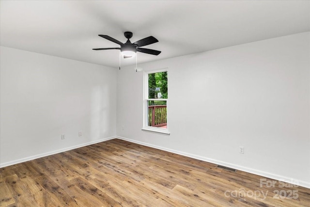 6839 Wagon Oak Rd, Charlotte, NC 28212 - unfurnished room featuring ceiling fan, baseboards, visible vents, and wood finished floors