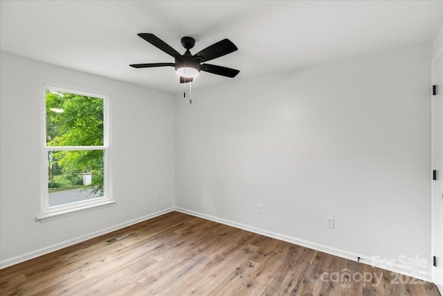 6839 Wagon Oak Rd, Charlotte, NC 28212 - spare room featuring baseboards, ceiling fan, visible vents, and wood finished floors