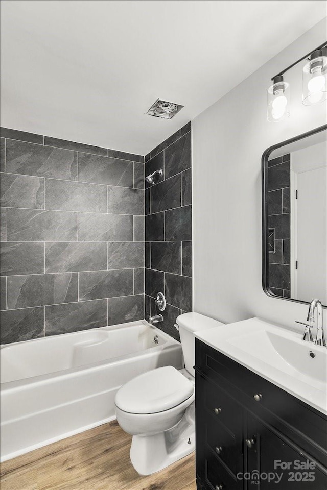 6839 Wagon Oak Rd, Charlotte, NC 28212 - full bath with toilet, shower / bath combination, vanity, and wood finished floors