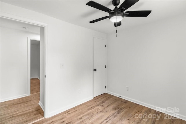 6839 Wagon Oak Rd, Charlotte, NC 28212 - spare room with light wood-style flooring, baseboards, and a ceiling fan