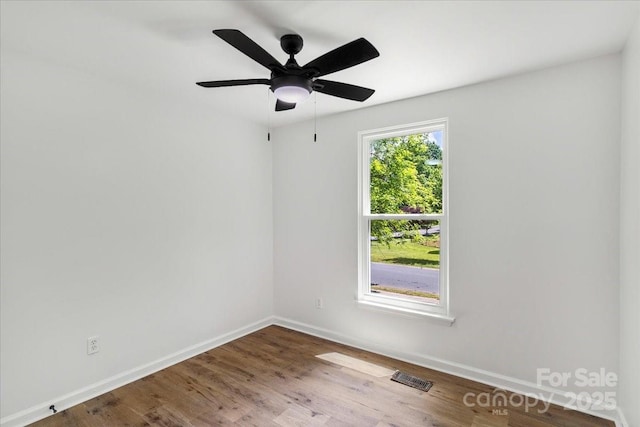 6839 Wagon Oak Rd, Charlotte, NC 28212 - unfurnished room with baseboards, ceiling fan, visible vents, and wood finished floors