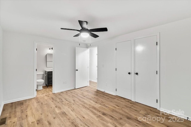 6839 Wagon Oak Rd, Charlotte, NC 28212 - unfurnished bedroom with ensuite bathroom, baseboards, a ceiling fan, and wood finished floors