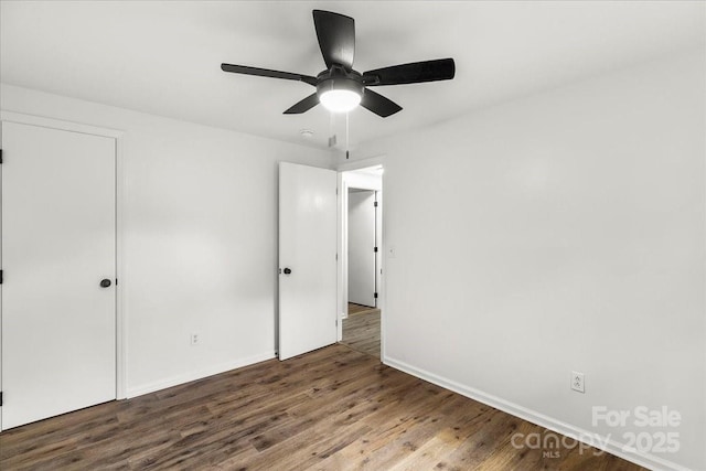 6839 Wagon Oak Rd, Charlotte, NC 28212 - unfurnished bedroom with ceiling fan, baseboards, and wood finished floors