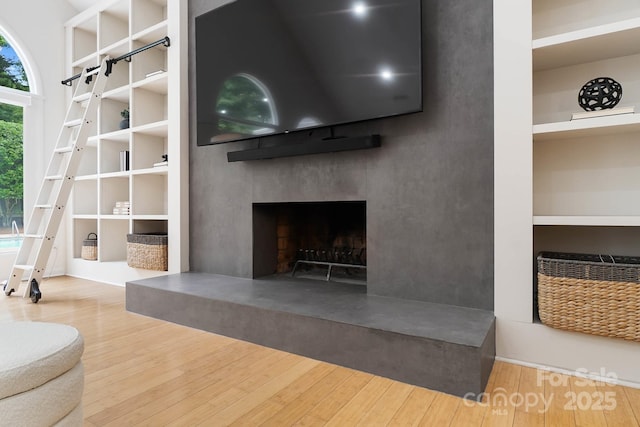 1245 Bellemeade Ln, Charlotte, NC 28270 - living room with wood finished floors and a fireplace with raised hearth