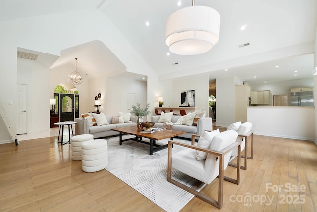 1245 Bellemeade Ln, Charlotte, NC 28270 - living area with light wood-style flooring, high vaulted ceiling, a chandelier, recessed lighting, and baseboards