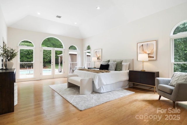 1245 Bellemeade Ln, Charlotte, NC 28270 - bedroom featuring access to exterior, light wood-style flooring, french doors, high vaulted ceiling, and recessed lighting