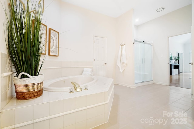 1245 Bellemeade Ln, Charlotte, NC 28270 - full bathroom with a garden tub, a shower stall, tile patterned floors, and baseboards