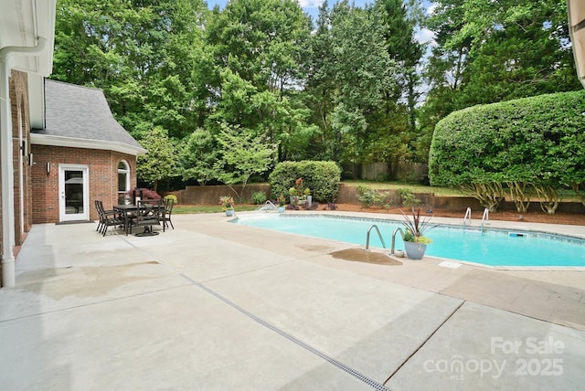 1245 Bellemeade Ln, Charlotte, NC 28270 - view of swimming pool featuring a fenced backyard, a patio area, and view of wooded area