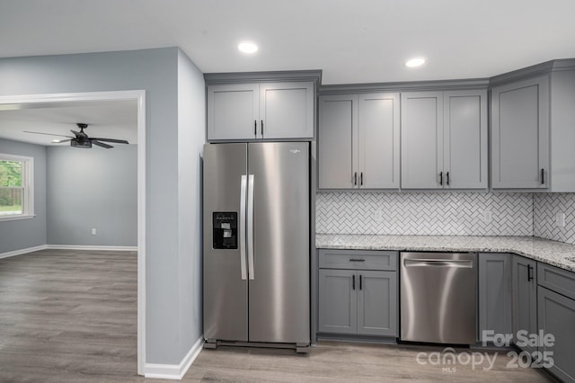 1428 E Main St, Cherryville, NC 28021 - kitchen featuring appliances with stainless steel finishes, gray cabinets, baseboards, decorative backsplash, and recessed lighting