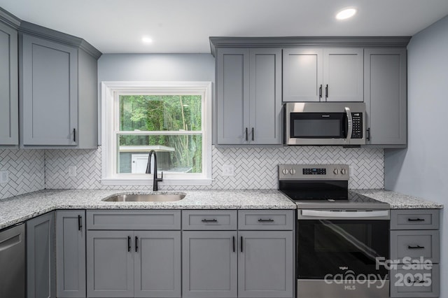 1428 E Main St, Cherryville, NC 28021 - kitchen featuring appliances with stainless steel finishes, a sink, gray cabinets, and recessed lighting