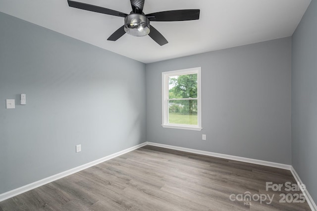 1428 E Main St, Cherryville, NC 28021 - spare room with wood finished floors, baseboards, and ceiling fan
