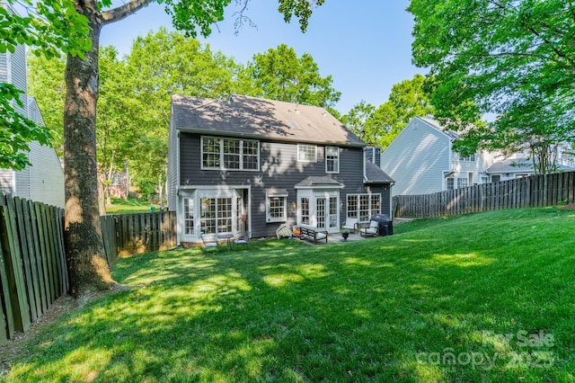 4201 Beauvista Dr, Charlotte, NC 28269 - back of property featuring a patio area, a lawn, and a fenced backyard