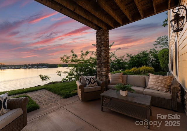 249 Landing Trl, Mount Gilead, NC 27306 - patio terrace at dusk with a water view and an outdoor living space