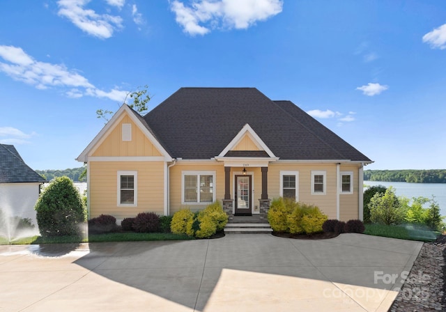 249 Landing Trl, Mount Gilead, NC 27306 - view of front of home with a water view and board and batten siding