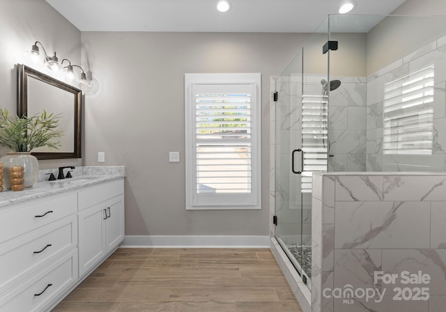 249 Landing Trl, Mount Gilead, NC 27306 - full bath featuring vanity, baseboards, wood finish floors, recessed lighting, and a stall shower