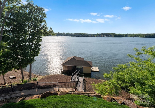 249 Landing Trl, Mount Gilead, NC 27306 - view of dock with a water view