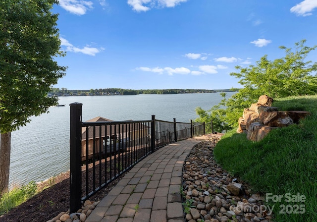 249 Landing Trl, Mount Gilead, NC 27306 - dock area featuring a water view and fence
