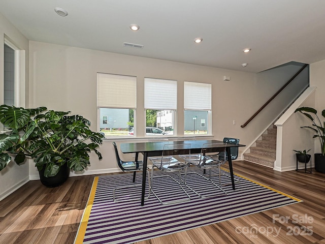 office space with baseboards, recessed lighting, visible vents, and wood finished floors
