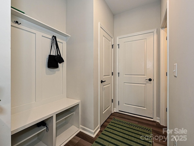 mudroom with baseboards and dark wood finished floors
