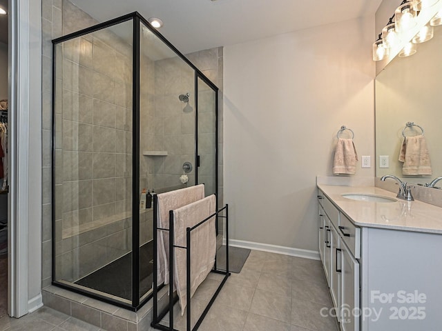 bathroom featuring baseboards, a shower stall, tile patterned flooring, vanity, and recessed lighting