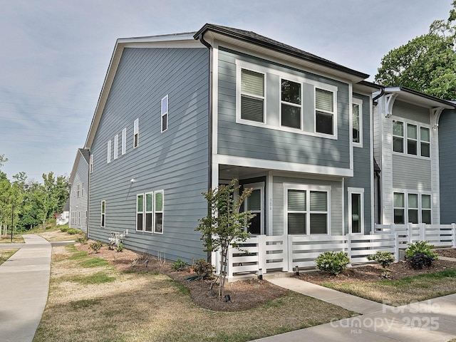 view of front of home with fence