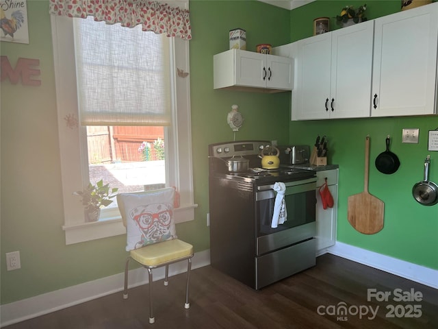 kitchen with white cabinets, dark wood-style flooring, baseboards, and stainless steel electric stove