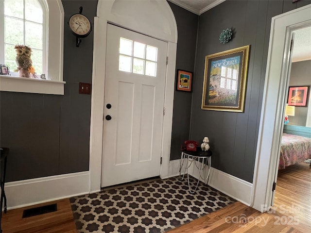 130 Arlington St, Forest City, NC 28043 - entryway featuring wood finished floors, ornamental molding, and arched walkways