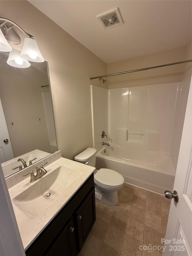 bathroom featuring visible vents, tile patterned flooring, vanity, bathing tub / shower combination, and toilet