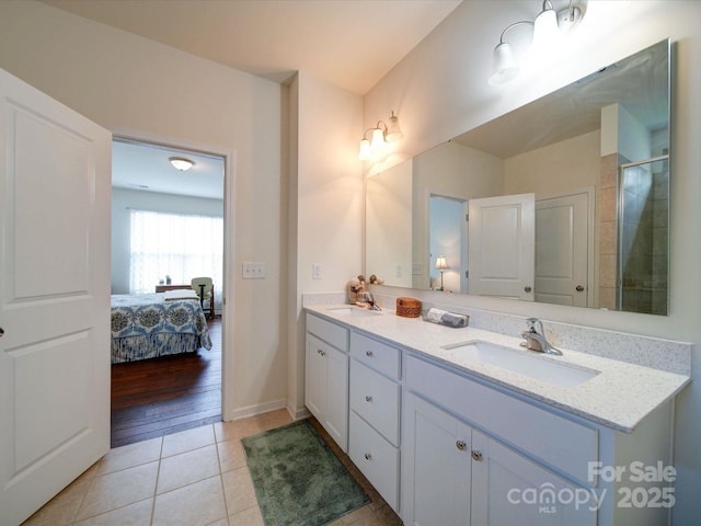 6266 Swanport Rd, Lancaster, SC 29720 - ensuite bathroom with double vanity, tile patterned floors, tiled shower, and baseboards