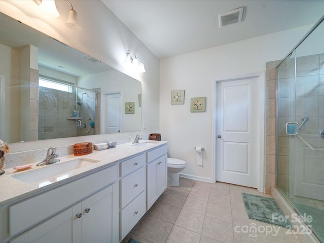6266 Swanport Rd, Lancaster, SC 29720 - full bath with tile patterned floors, a stall shower, double vanity, toilet, and baseboards