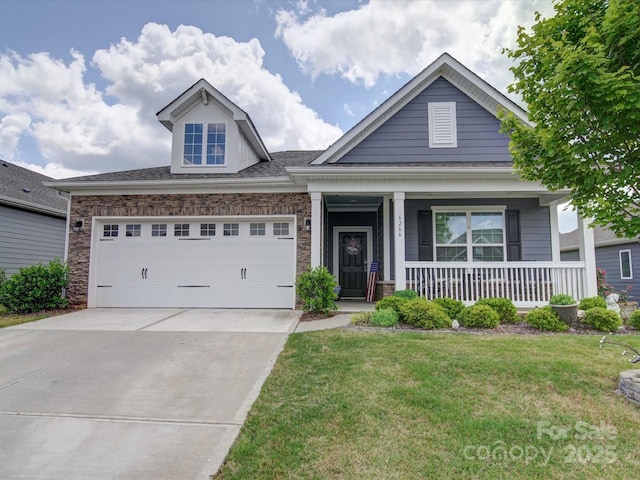 6266 Swanport Rd, Lancaster, SC 29720 - view of front of house featuring a porch, a front yard, driveway, an attached garage, and stone siding