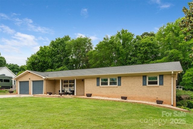 213 Lakeview Dr, Harrisburg, NC 28075 - ranch-style house featuring a garage, a front lawn, brick siding, and concrete driveway