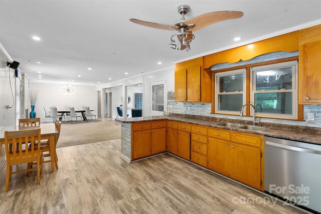 213 Lakeview Dr, Harrisburg, NC 28075 - kitchen with dishwasher, a sink, recessed lighting, dark countertops, and decorative backsplash
