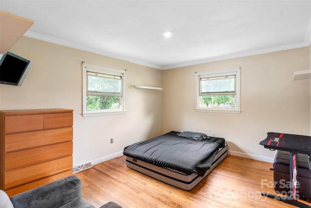 213 Lakeview Dr, Harrisburg, NC 28075 - bedroom with ornamental molding, baseboards, and wood finished floors